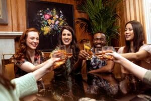a group of women toasting with cocktails